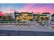 Stunning modern home featuring desert landscaping with a captivating pink and blue sunset backdrop at 12809 N 67Th St, Scottsdale, AZ 85254