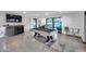 Entertaining game room with a pool table, bar, and sliding glass doors that open to the backyard at 12809 N 67Th St, Scottsdale, AZ 85254