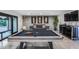 Spacious game room featuring a pool table, modern decor, and stylish furnishings for entertaining at 12809 N 67Th St, Scottsdale, AZ 85254
