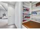 Hallway nook with integrated bench, shelving, and additional storage provides a cozy space at 12809 N 67Th St, Scottsdale, AZ 85254