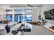 Bright, modern living room featuring high ceilings, a pit seating area, and large windows with neighborhood views at 12809 N 67Th St, Scottsdale, AZ 85254