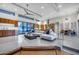 Bright open-concept living space features clerestory windows, modern kitchen, dining area, and sleek, polished floors at 12809 N 67Th St, Scottsdale, AZ 85254
