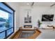 Living area with a recessed lounge area, fireplace, and bright views from the window at 12809 N 67Th St, Scottsdale, AZ 85254