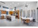 Open concept living space with kitchen, dining area and island with bar stool seating at 12809 N 67Th St, Scottsdale, AZ 85254