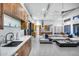 Open-concept kitchen and living area featuring modern wood cabinets and a large island at 12809 N 67Th St, Scottsdale, AZ 85254