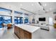 Spacious open-concept area featuring living, dining and kitchen spaces with expansive windows at 12809 N 67Th St, Scottsdale, AZ 85254