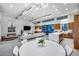 Open concept living space with fireplace, kitchen island and sliding glass doors at 12809 N 67Th St, Scottsdale, AZ 85254
