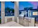 Modern outdoor kitchen with stainless steel appliances, a built-in grill, and ample counter space for outdoor entertaining at 12809 N 67Th St, Scottsdale, AZ 85254