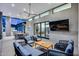 Spacious covered patio with comfortable seating, a dining area, and a view of the lush backyard and pool at 12809 N 67Th St, Scottsdale, AZ 85254