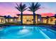 Swimming pool and backyard of home with large windows and covered patios at 12809 N 67Th St, Scottsdale, AZ 85254