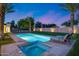 Swimming pool with a hot tub and lounge chairs in the backyard at 12809 N 67Th St, Scottsdale, AZ 85254