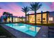 Stunning backyard pool with palm trees and a spacious green lawn at 12809 N 67Th St, Scottsdale, AZ 85254