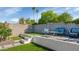 Private backyard with an artificial lawn, block wall, and patio seating area at 15028 N 9Th St, Phoenix, AZ 85022