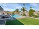 Inviting backyard with pool, turf, and desert landscaping at 15028 N 9Th St, Phoenix, AZ 85022