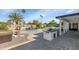 Spacious backyard with a pool, BBQ island, and covered patio at 15028 N 9Th St, Phoenix, AZ 85022