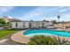 Backyard featuring a pool, artificial turf, and outdoor seating at 15028 N 9Th St, Phoenix, AZ 85022