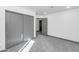 Bedroom with carpet flooring, neutral colored walls, and sliding closet doors at 15028 N 9Th St, Phoenix, AZ 85022