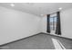 This bedroom features neutral walls, carpet flooring, and natural light at 15028 N 9Th St, Phoenix, AZ 85022