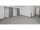 Bright bedroom with carpeted floor and open closet with shelving at 15028 N 9Th St, Phoenix, AZ 85022