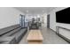 Open living area with modern furniture flows into the kitchen with stainless appliances at 15028 N 9Th St, Phoenix, AZ 85022