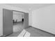 Neutral room showcases grey doors, tile flooring, and a view to another living space at 15028 N 9Th St, Phoenix, AZ 85022
