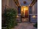 Charming gated front entrance with stone pillars and a well-manicured bush at 15664 W Vernon Ave, Goodyear, AZ 85395