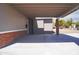 Attached carport with space for multiple cars and access to the home's front door at 2035 W Claremont St, Phoenix, AZ 85015