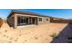 View of the covered patio and backyard with a blank canvas awaiting landscaping possibilities at 24054 N 171St Dr, Surprise, AZ 85387