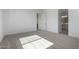 Carpeted bedroom showcasing an ensuite bathroom and walk-in closet at 24054 N 171St Dr, Surprise, AZ 85387
