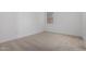 Neutral carpeted bedroom with ample natural light and a clean, minimalist aesthetic at 24054 N 171St Dr, Surprise, AZ 85387