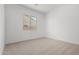 Carpeted bedroom boasting natural light and window views at 24054 N 171St Dr, Surprise, AZ 85387