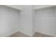 Walk-in closet with rods for hanging and carpet flooring at 24054 N 171St Dr, Surprise, AZ 85387