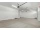 Clean and spacious three-car garage with ample room for parking and storage at 24054 N 171St Dr, Surprise, AZ 85387