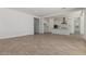 Open-concept living room with tile floors connecting to a modern, stylish kitchen at 24054 N 171St Dr, Surprise, AZ 85387