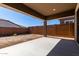 Covered patio with a concrete floor, ideal for outdoor relaxation and entertaining at 24054 N 171St Dr, Surprise, AZ 85387