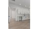 Functional room featuring a counter with cabinets, a sink, and tile flooring at 24054 N 171St Dr, Surprise, AZ 85387