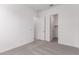 Neutral bedroom showcasing carpeted floors and a closet at 24078 N 171St Dr, Surprise, AZ 85387