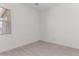 Bright bedroom with modern tile flooring and a window offering natural light at 24078 N 171St Dr, Surprise, AZ 85387