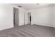 Spacious bedroom with plush carpeting and white walls at 24078 N 171St Dr, Surprise, AZ 85387