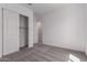 Bright bedroom boasts sliding closet doors and carpet flooring, creating a cozy space at 24078 N 171St Dr, Surprise, AZ 85387