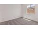 Cozy bedroom featuring carpeted floors and a bright window at 24078 N 171St Dr, Surprise, AZ 85387