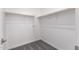 Walk-in closet with a carpeted floor and shelving at 24078 N 171St Dr, Surprise, AZ 85387