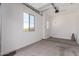 Spacious two-car garage featuring epoxy flooring and a window for natural light at 24078 N 171St Dr, Surprise, AZ 85387
