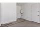 Bright garage featuring concrete flooring and a water heater at 24078 N 171St Dr, Surprise, AZ 85387