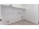 Laundry room with tile flooring, shelving, and washer/dryer hookups at 24078 N 171St Dr, Surprise, AZ 85387