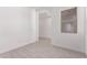 Open room featuring tile floors and a bright window at 24078 N 171St Dr, Surprise, AZ 85387