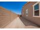 Wide side yard showing ample space, block fence, and a convenient gate at 24078 N 171St Dr, Surprise, AZ 85387