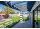 Backyard featuring an outdoor living space with artificial turf and a pergola at 3010 E Glenrosa Ave, Phoenix, AZ 85016