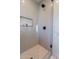 This bathroom has a glass enclosed shower with sleek black fixtures and a built-in shelf at 3010 E Glenrosa Ave, Phoenix, AZ 85016