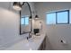 This powder room has a unique mirror, modern light fixtures, and a floating vanity at 3010 E Glenrosa Ave, Phoenix, AZ 85016